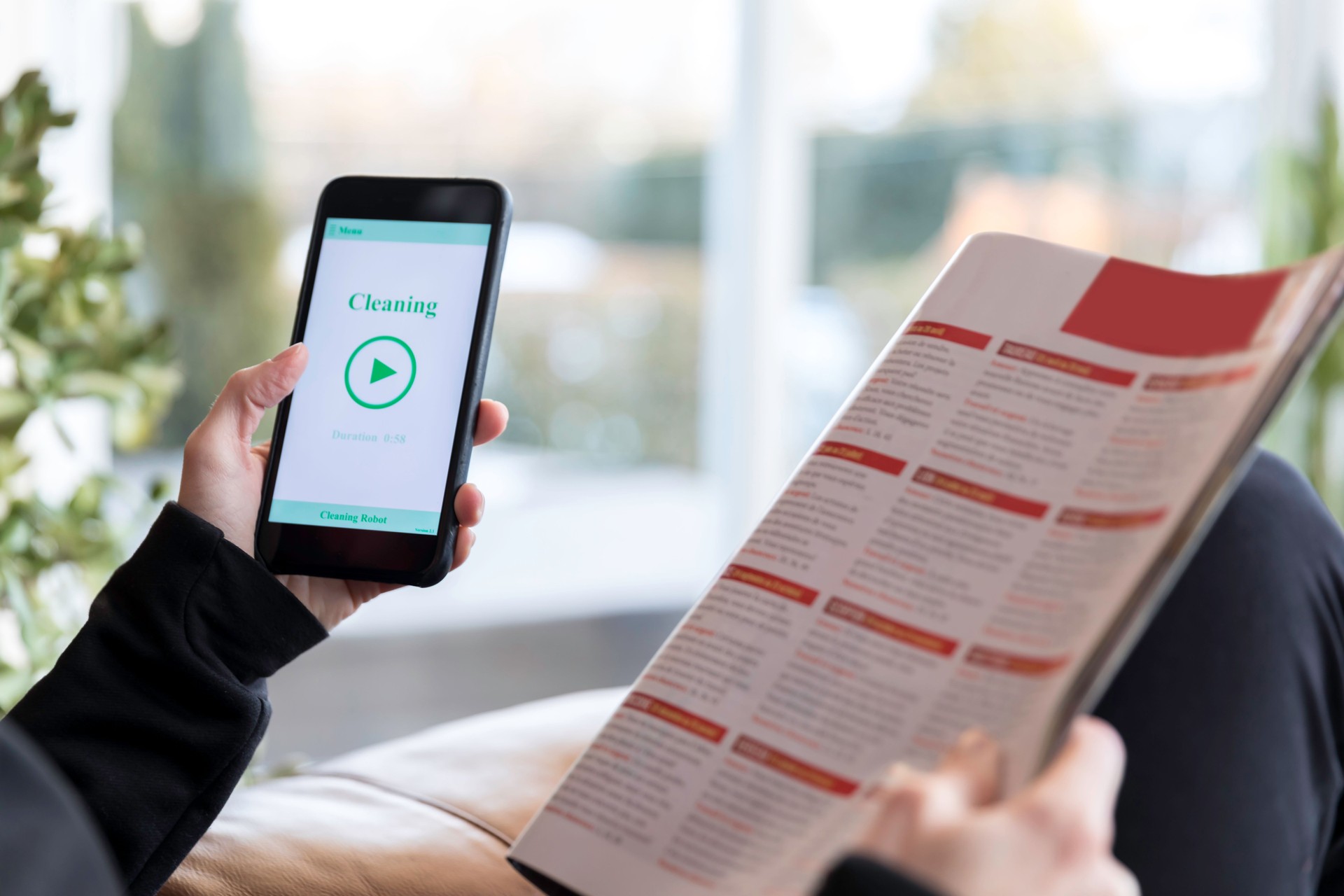 Woman Using Home Robot Cleaning App on Mobile Phone
